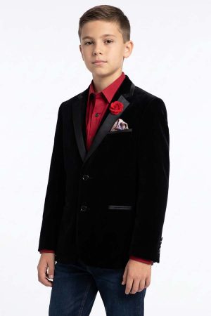 a boy wearing a velvet blazer with a pike lapel in black satin