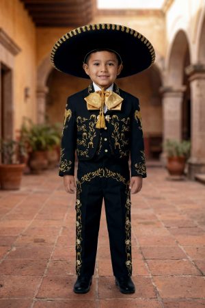 Boy wearing a black and gold charro mariachi suit with gold embroidered horseshoes and horse heads, gold metal buttons, matching sombrero, vest, white shirt, and bow tie.