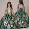 a girl wearing an emerald green dress covered in embellished sequins. Image shows both sides of the dress
