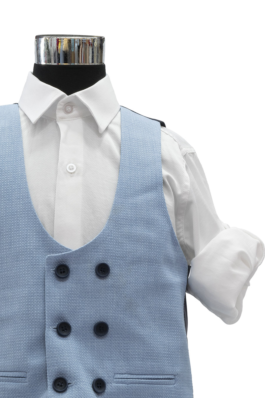 light blue vest with navy buttons and white roll up shirt