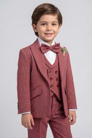 Young boy wearing a burgundy formal suit with jacket, double-breasted vest, white shirt, and bow tie.