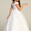 All white tea length dress for girls with corset back dress with slight shinny glitter skirt. perfect for first communions.