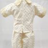 An ivory baptism outfit for boys , shown here from the back without the coal: shirt and pants only.