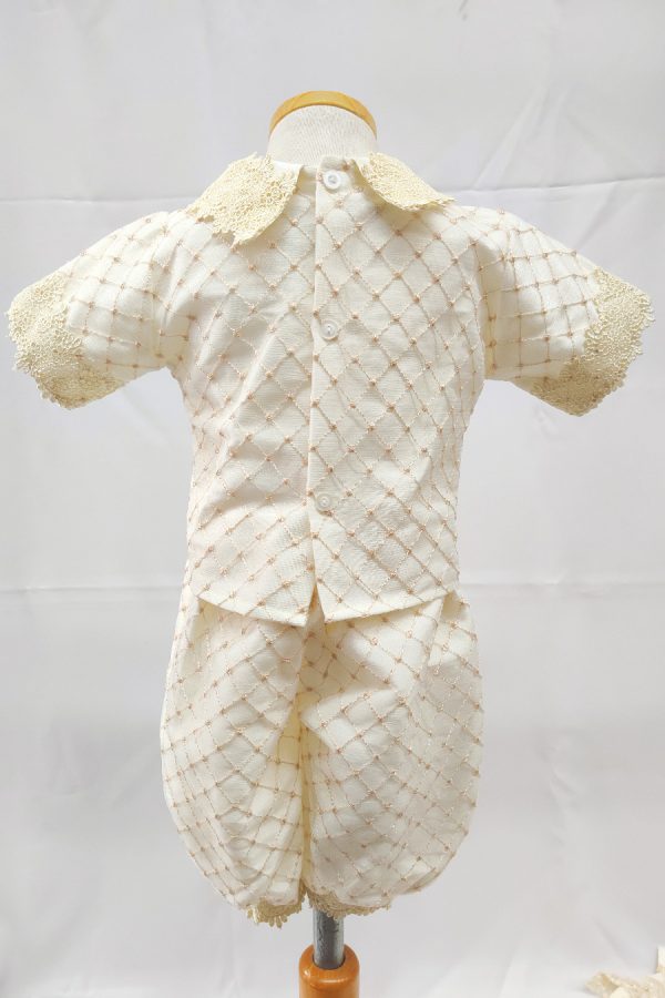 An ivory baptism outfit for boys , shown here from the back without the coal: shirt and pants only.