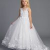 Young girl wearing a white sleeveless formal dress with floral appliqué bodice and full tulle skirt on a neutral background.